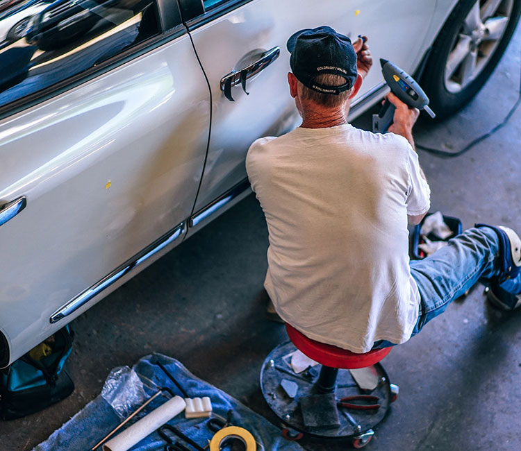 man scanning a vehicle